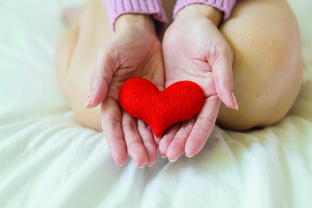 Woman offering her heart