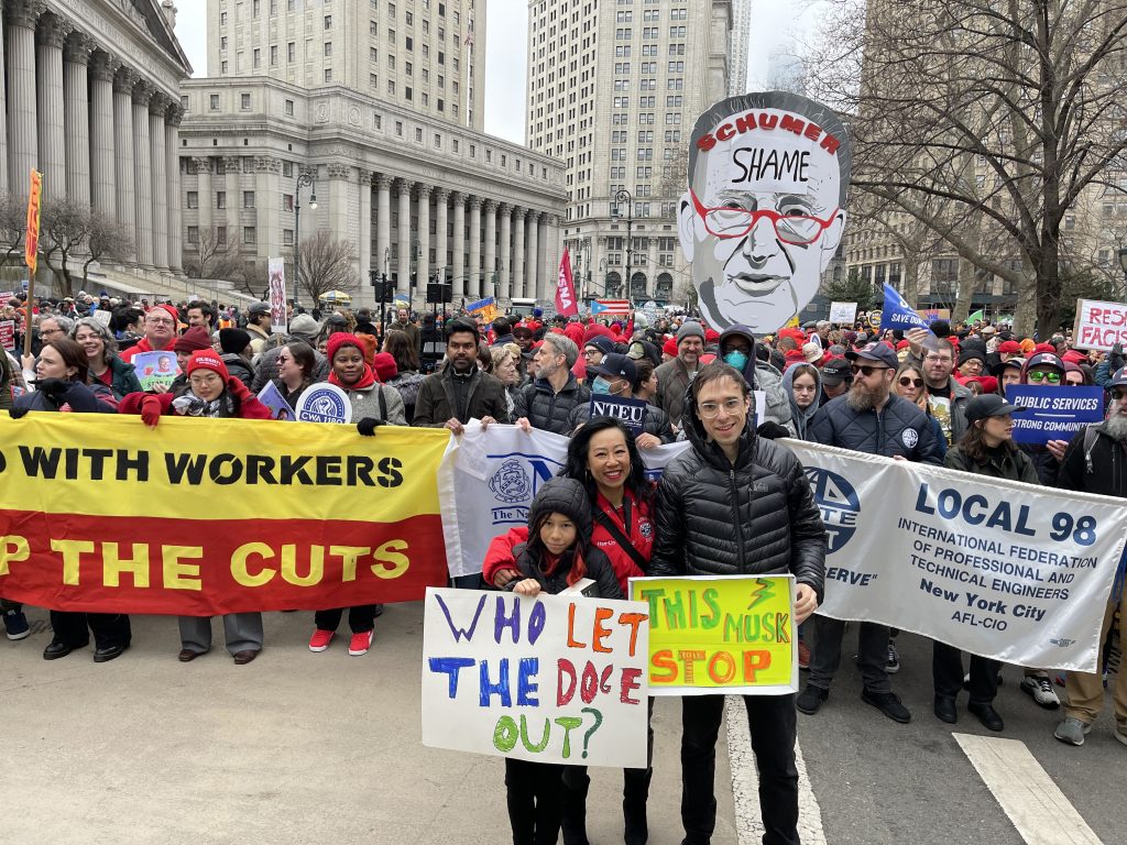 IndyKids reporter Nico Levitan with her parents at a rally in New York City, March 2025